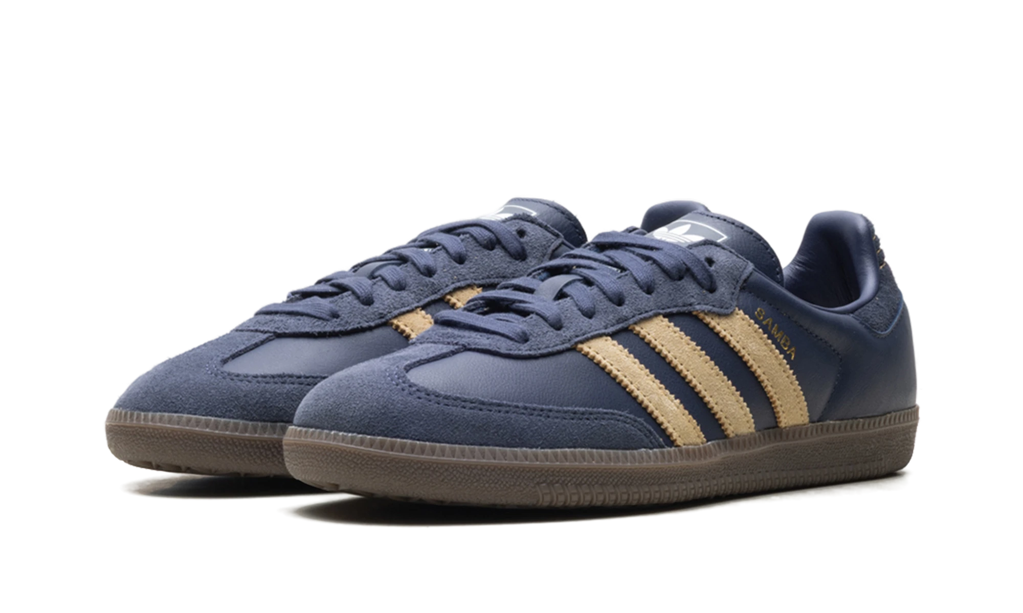 Detail of the inner side of the sneaker Adidas Samba OG Shadow Navy Golden Beige bleu, beige et marron.