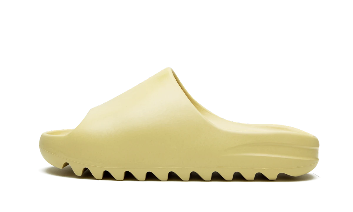 Slide Adidas Yeezy Slide Desert Sand in leather beige, available in Europe — outer profile view.