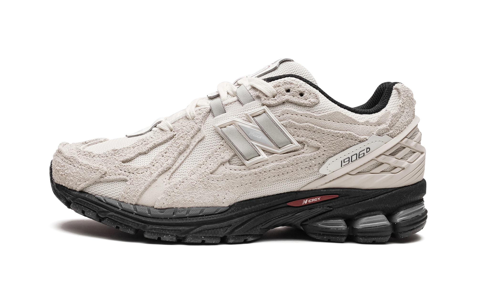 Sneaker New Balance 1906D Protection Pack Turtledove in suede black and beige, available in Europe — outer profile view.