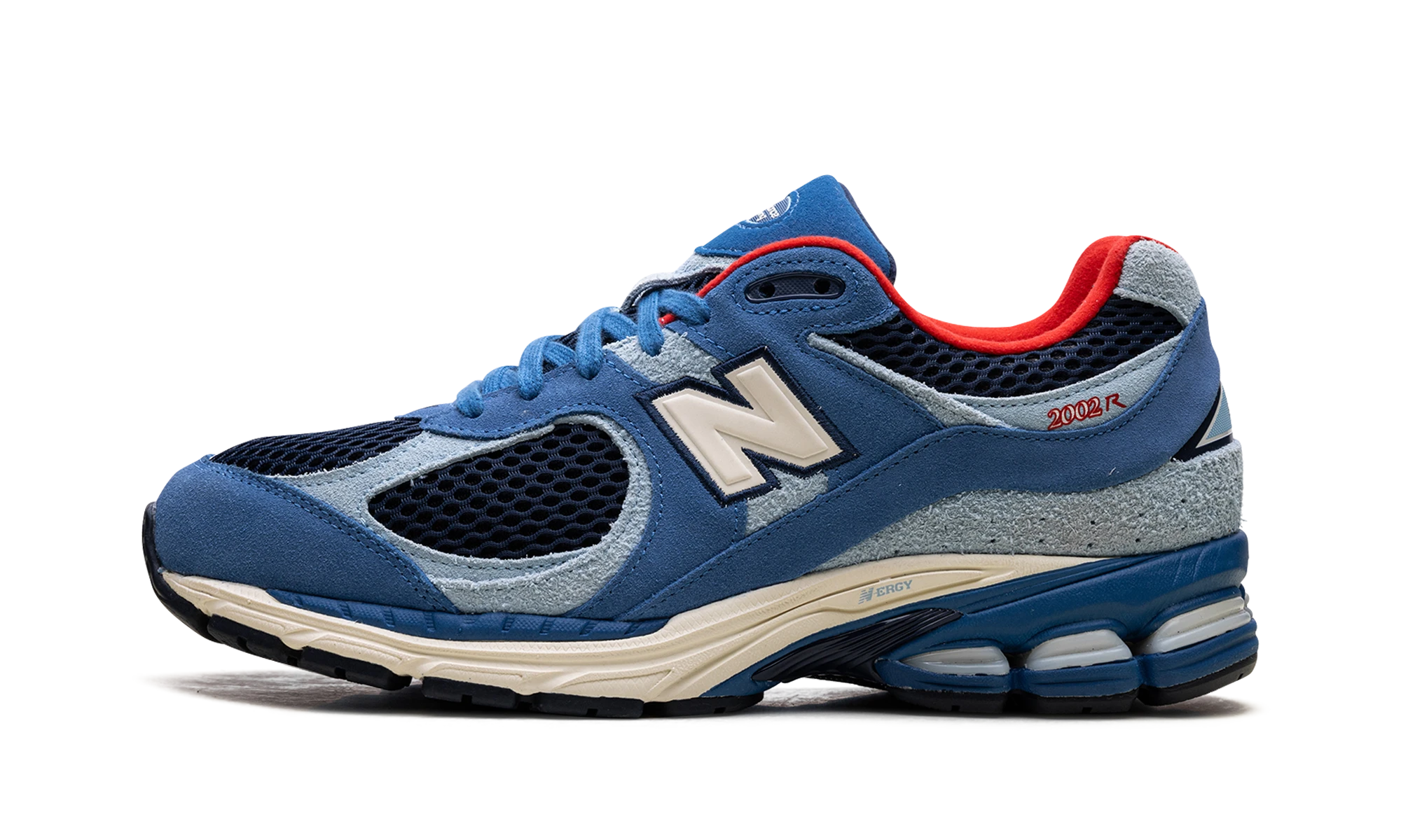 Sneaker New Balance 2002R Shoe Palace Volcanic Rocks Blue (M2002RRM) in leather blue and red — outer profile view.