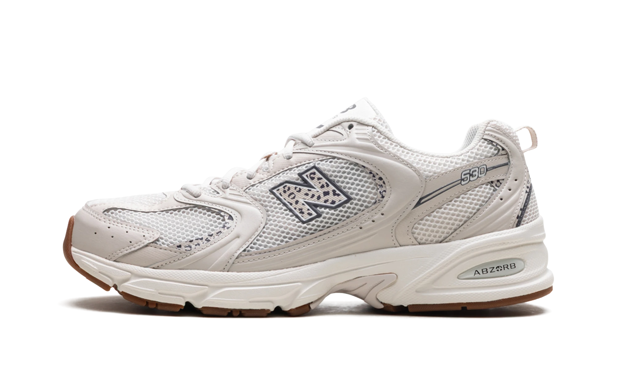 Sneaker New Balance 530 Moonbeam Cow Print in leather white and black, available in Europe — outer profile view.