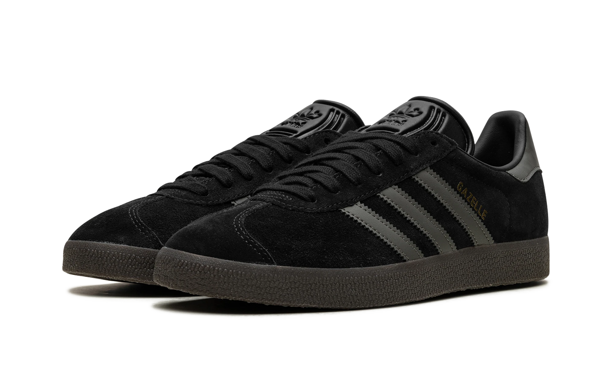 Dettaglio del lato interno della scarpa Adidas Gazelle Core Black Gum (ID6105) noir, or et marron.