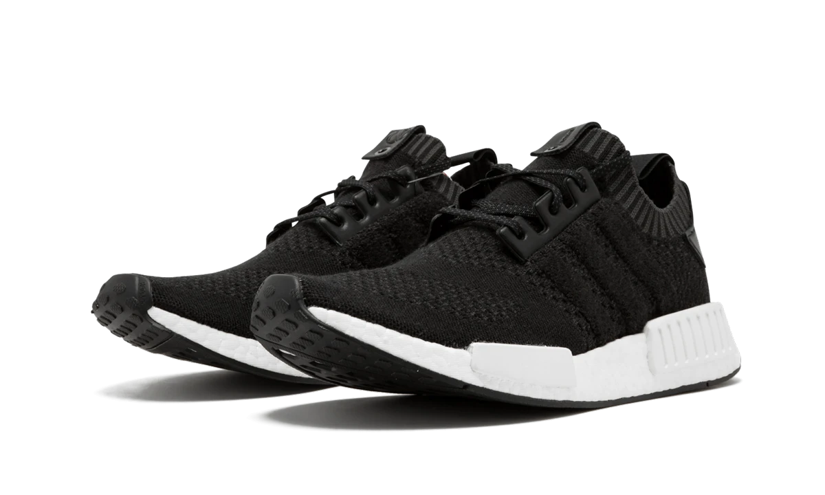 Detail of the inner side of the sneaker Adidas NMD R1 A Ma Maniere x Invincible Cashmere Wool (CM7879) noir et gris.